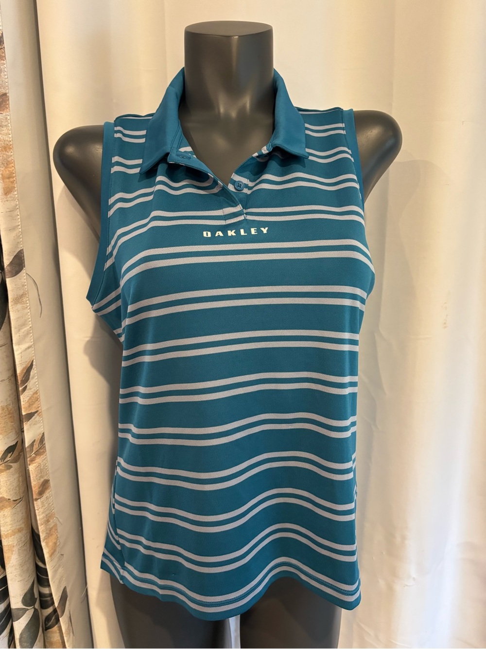 Oakley Teal and Light Blue Striped Sleeveless Polo and green and white polo